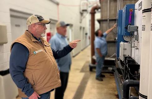 Birchtech team reviewing industrial water-treatment equipment
